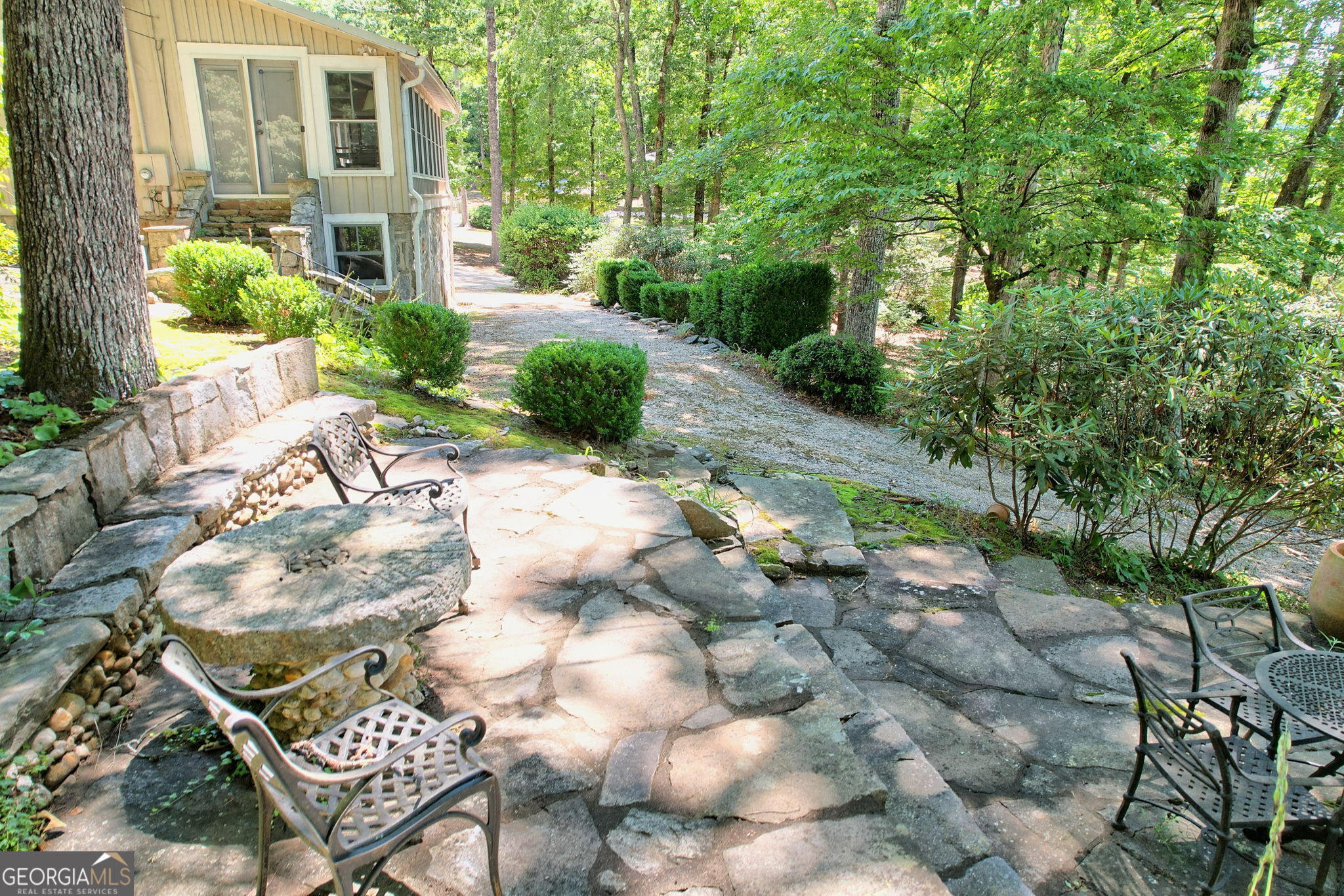 208 Colony Road Dillard, GA 30537 - Photo 78 of 80 a view of backyard with table and chairs and potted plants