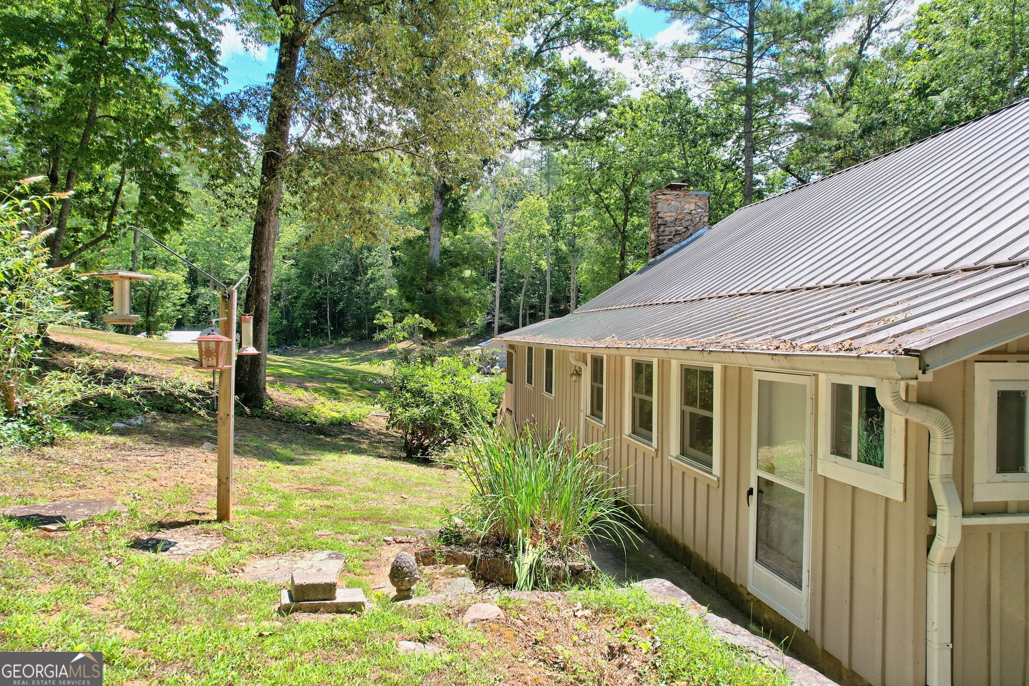 208 Colony Road Dillard, GA 30537 - Photo 79 of 80 a view of a house with backyard and sitting area