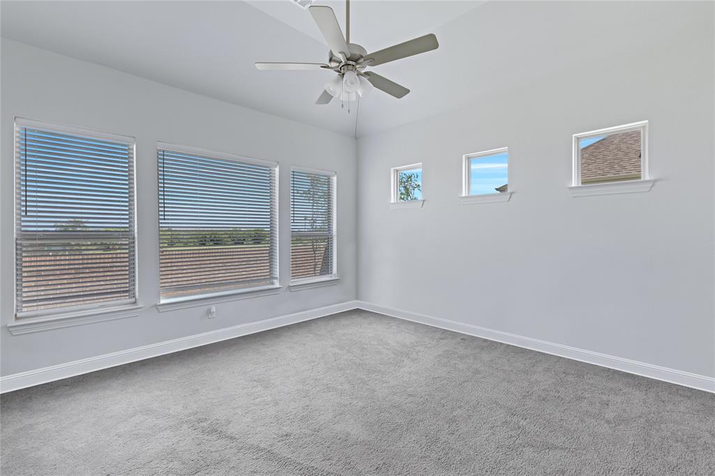 2307 Sam Street Mansfield, TX 76063 - Photo 11 of 23 Unfurnished room with light carpet and a ceiling fan