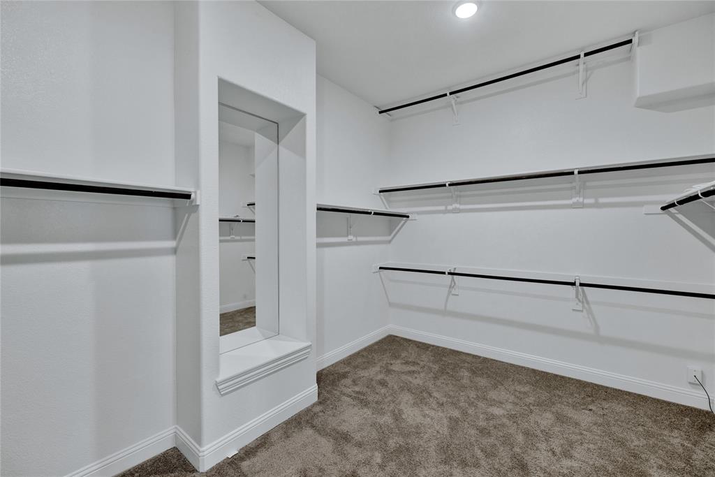 2307 Sam Street Mansfield, TX 76063 - Photo 13 of 23 Walk in closet with light colored carpet