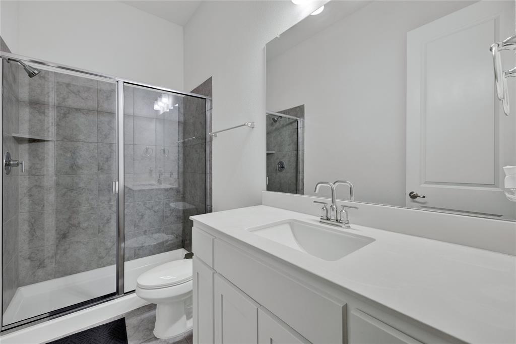 2307 Sam Street Mansfield, TX 76063 - Photo 7 of 23 Bathroom with vanity and a shower stall