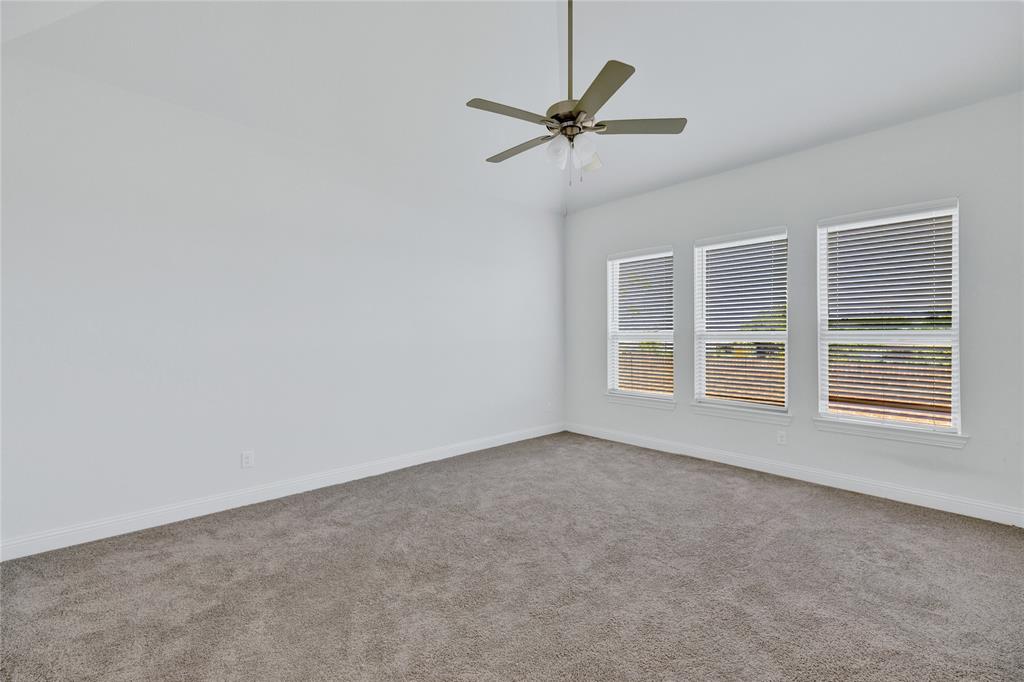 2307 Sam Street Mansfield, TX 76063 - Photo 10 of 23 Spare room with carpet, ceiling fan, and lofted ceiling