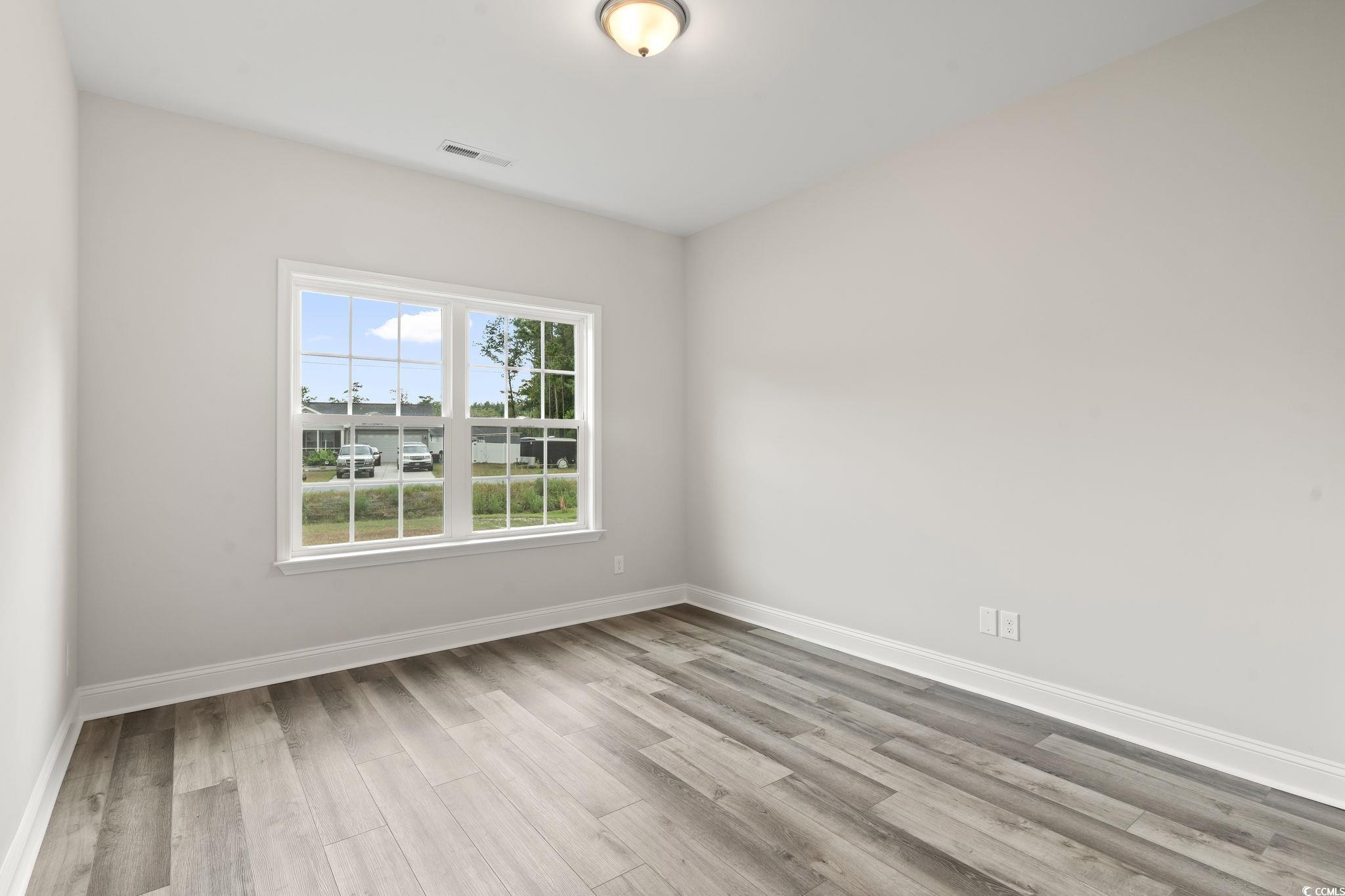 5987 Flossie Road Conway, SC 29527 - Photo 31 of 38 Unfurnished bedroom with light hardwood / wood-sty