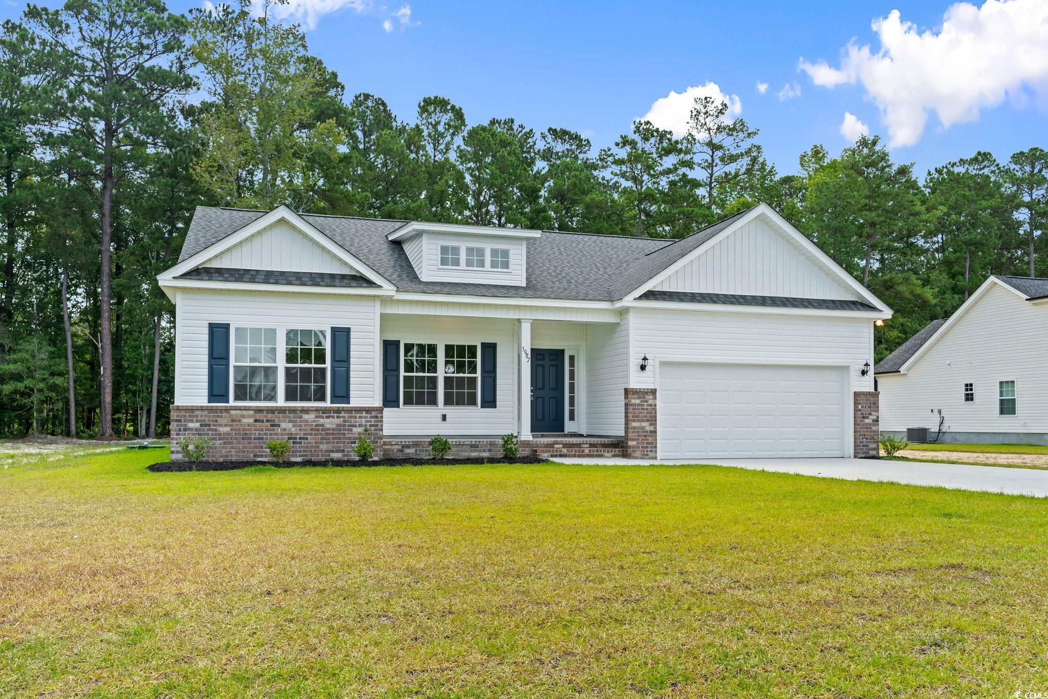 5987 Flossie Road Conway, SC 29527 - Photo 5 of 38 Craftsman-style house with a garage and a front ya