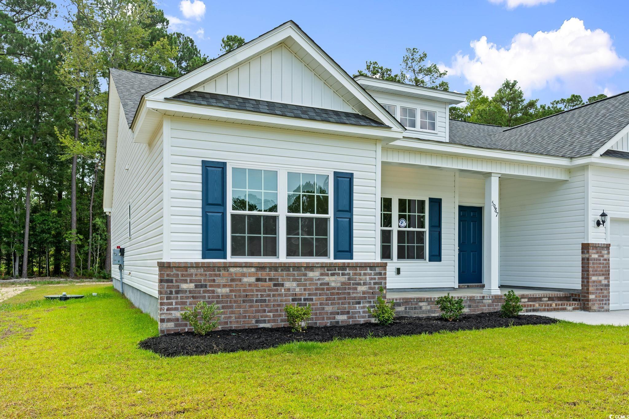 5987 Flossie Road Conway, SC 29527 - Photo 6 of 38 View of front of house with a garage and a front l