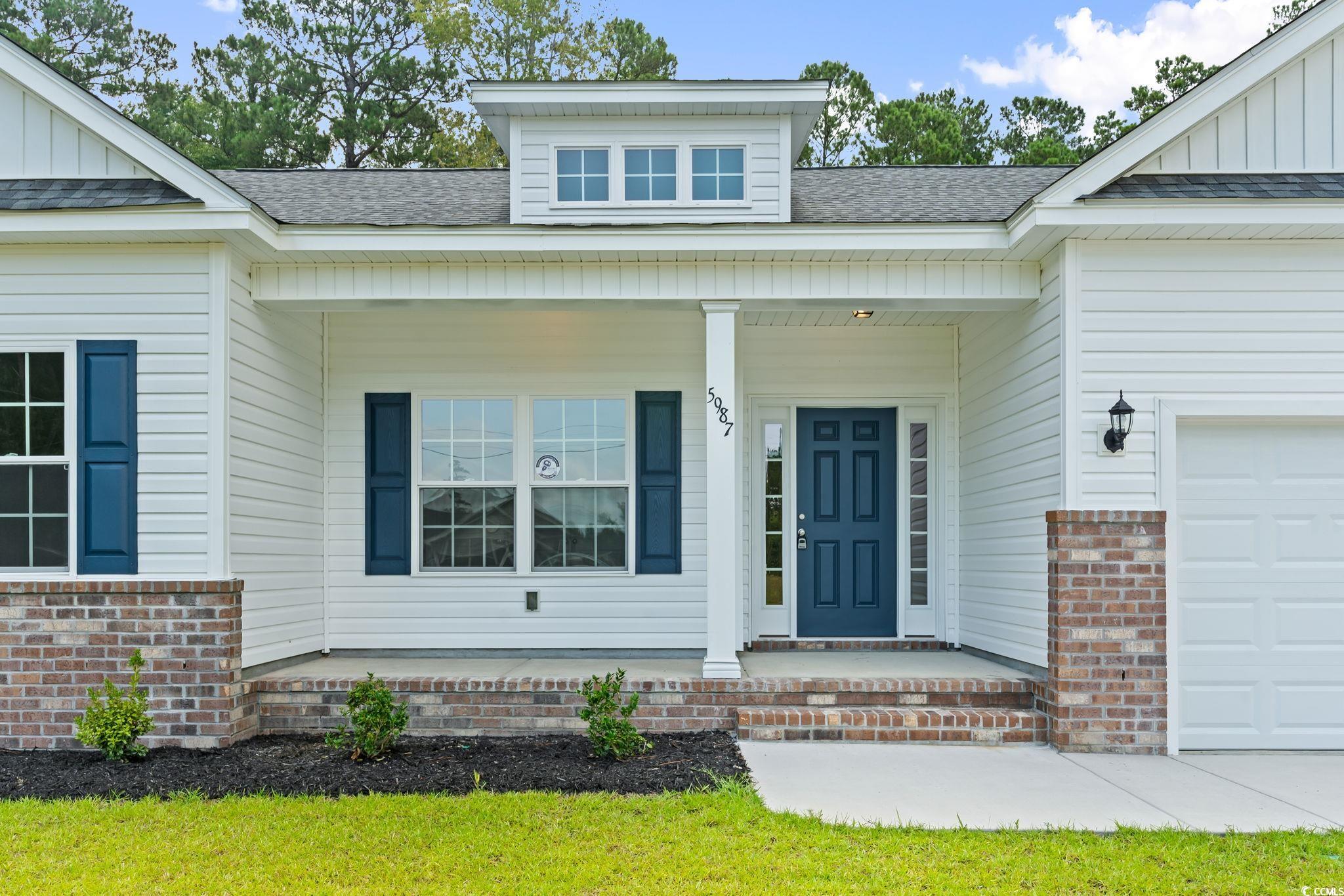 5987 Flossie Road Conway, SC 29527 - Photo 7 of 38 Entrance to property with a porch and a garage