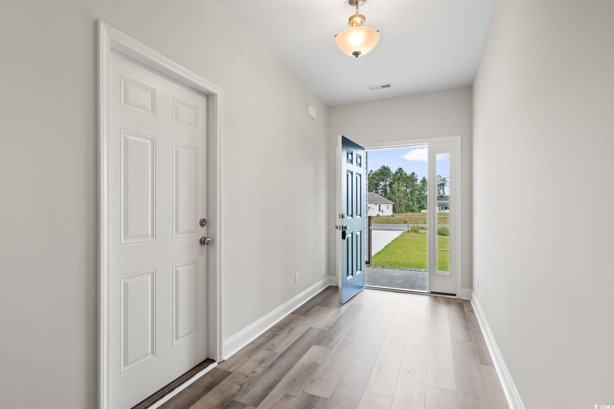 5987 Flossie Road Conway, SC 29527 - Photo 8 of 38 Entryway with hardwood / wood-style flooring