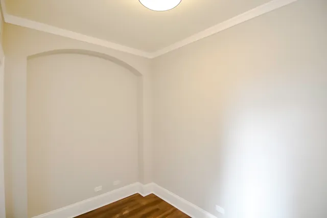 a view of a small space with wooden floor