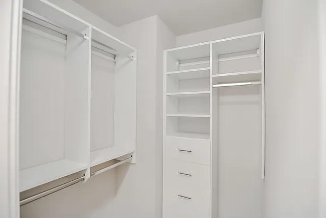a view of an empty walk in closet