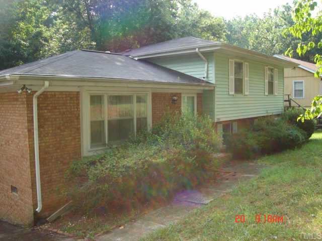 2421 Foxtrot Road Raleigh, NC 27610 - Photo 1 of 1 a view of a yard in front of a house with large windows