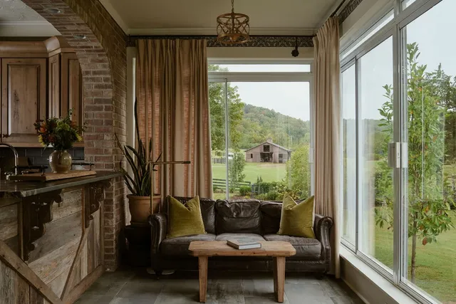 a front view of house with a garden