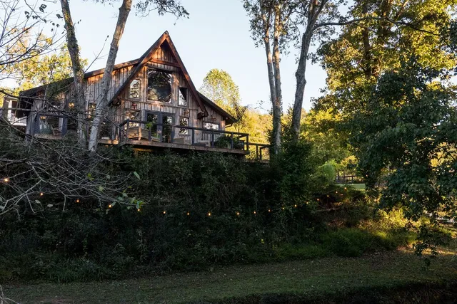 a front view of house along with wooden stairs