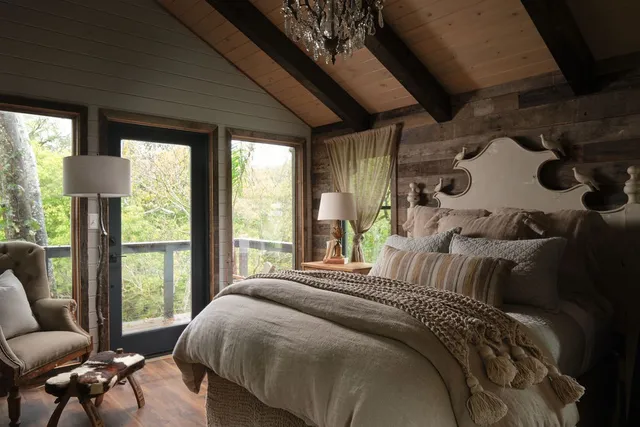 a living room with a couch and a chandelier