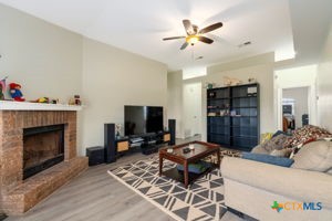 102 Lariat Circle Copperas Cove, TX 76522 - Photo 2 of 14 a living room with furniture a fireplace and a flat screen tv