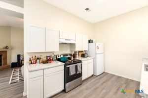 102 Lariat Circle Copperas Cove, TX 76522 - Photo 4 of 14 a kitchen with a sink stove and cabinets