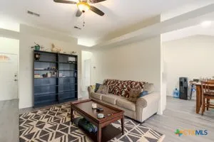 a living room with furniture and a rug