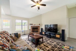 102 Lariat Circle Copperas Cove, TX 76522 - Photo 8 of 14 a living room with furniture a flat screen tv and a fireplace