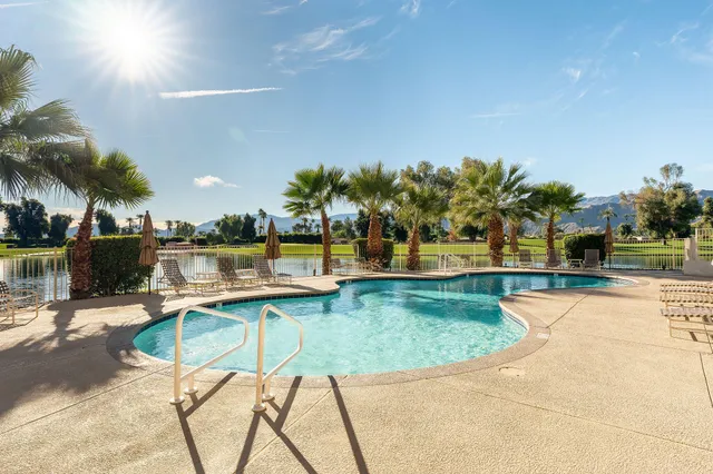 a view of a swimming pool with a patio