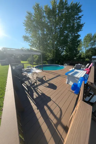 a view of a patio with wooden floor