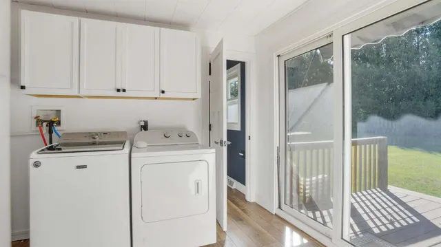 a view of a storage and utility room with washer and dryer
