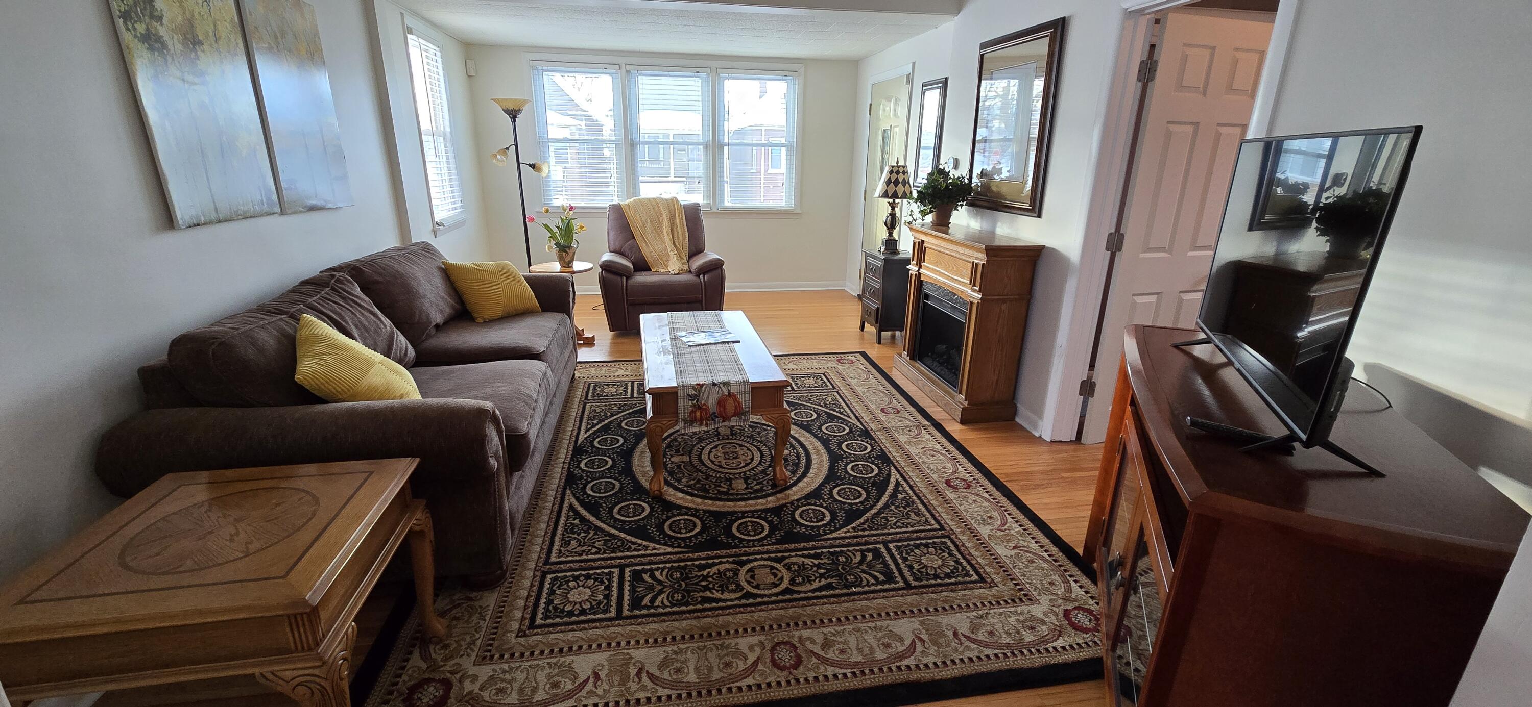 1647 Myrtle Avenue, Unit 1 Whiting, IN 46394 - Photo 3 of 20 a living room with furniture and a fireplace