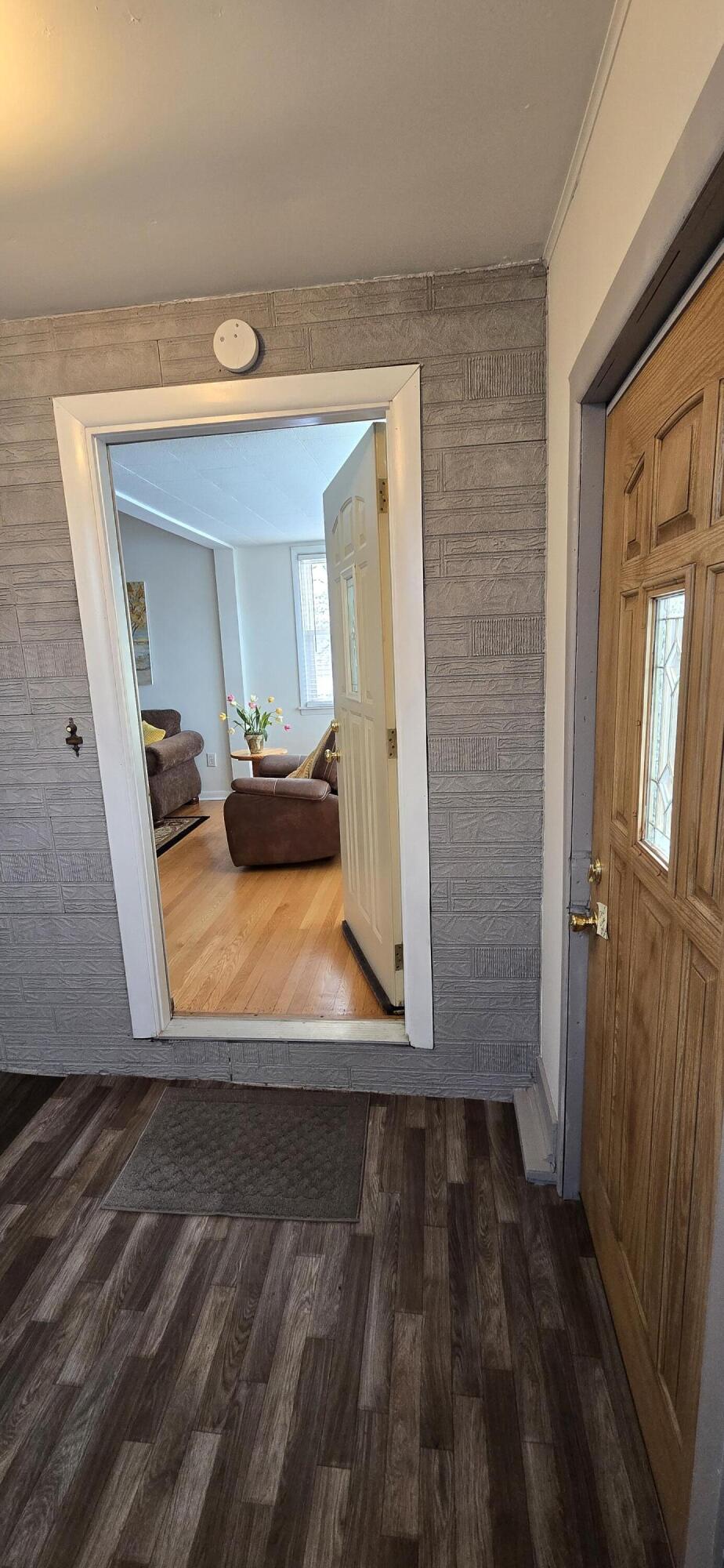 1647 Myrtle Avenue, Unit 1 Whiting, IN 46394 - Photo 7 of 20 a view of a bedroom with wooden floor and bedroom