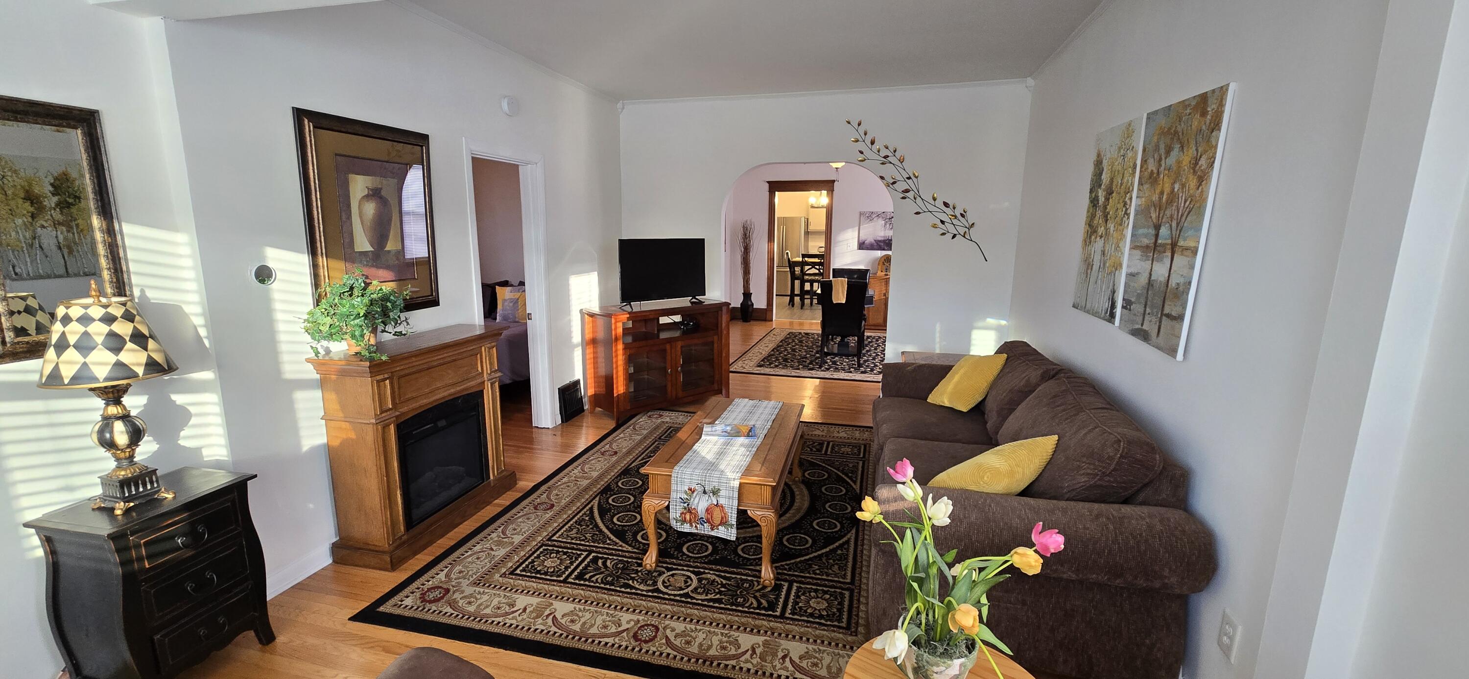 1647 Myrtle Avenue, Unit 1 Whiting, IN 46394 - Photo 8 of 20 a living room with furniture and a flat screen tv