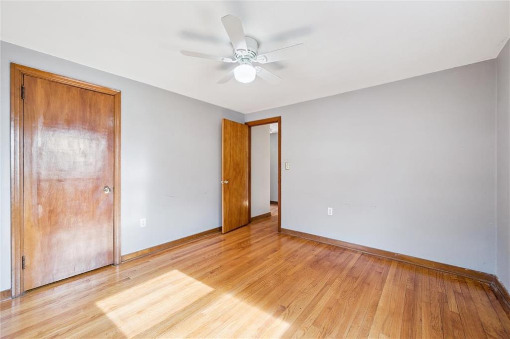 1167 Lapish Road Pittsburgh, PA 15212 - Photo 18 of 45 a view of an empty room with wooden floor