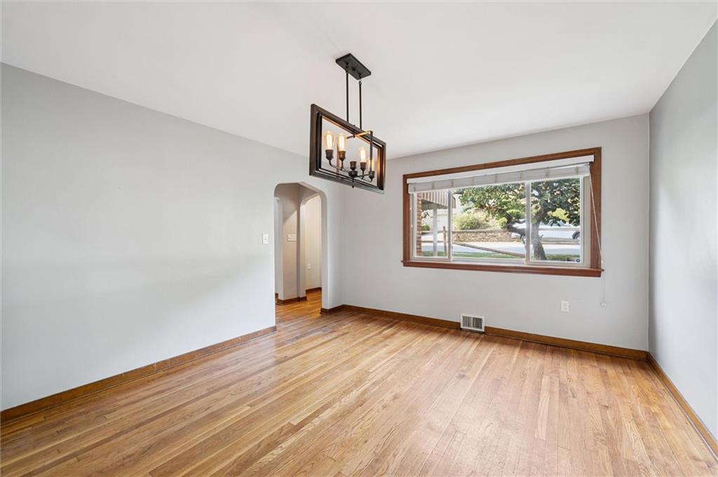 1167 Lapish Road Pittsburgh, PA 15212 - Photo 8 of 45 a view of an empty room with window and wooden floor
