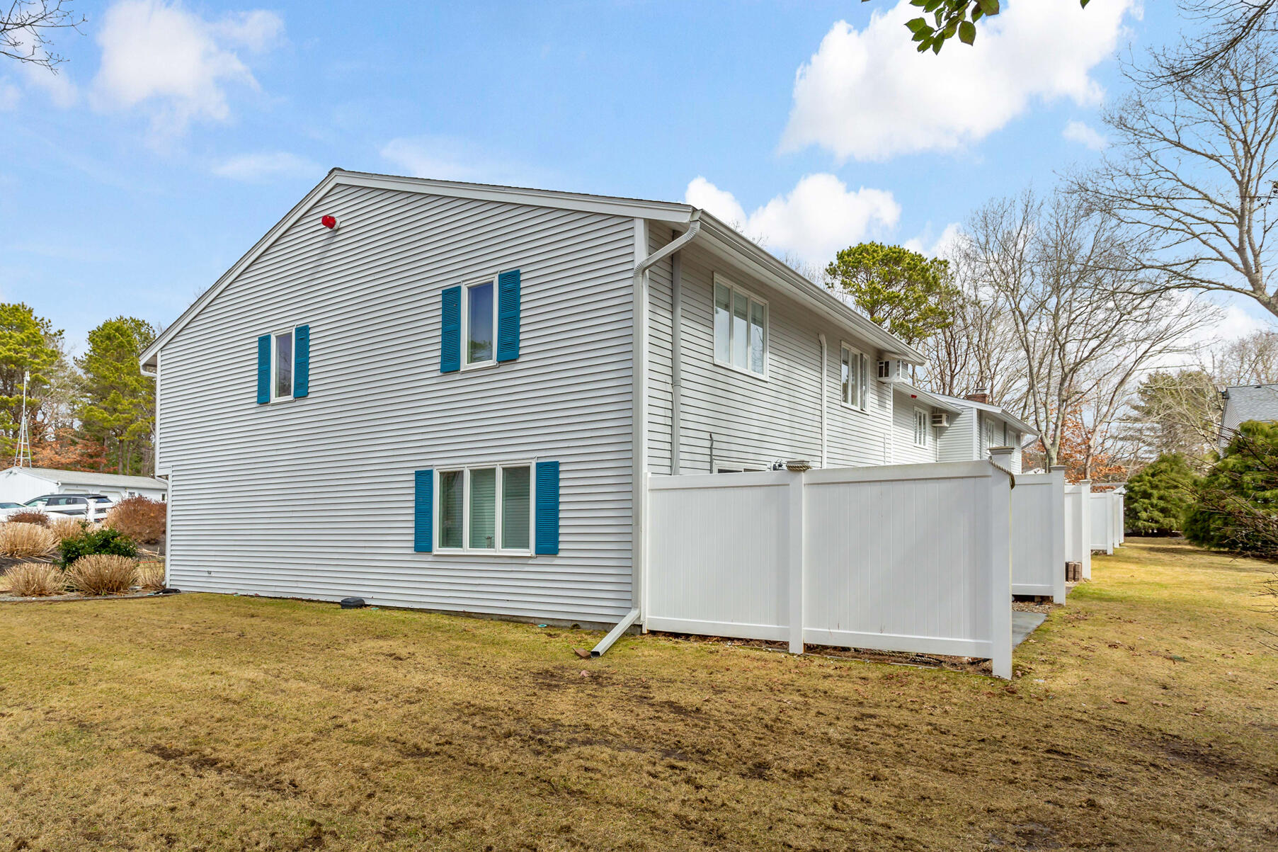 174 Lowell Road, Unit E59 Mashpee, MA 02649 - Photo 13 of 19 side