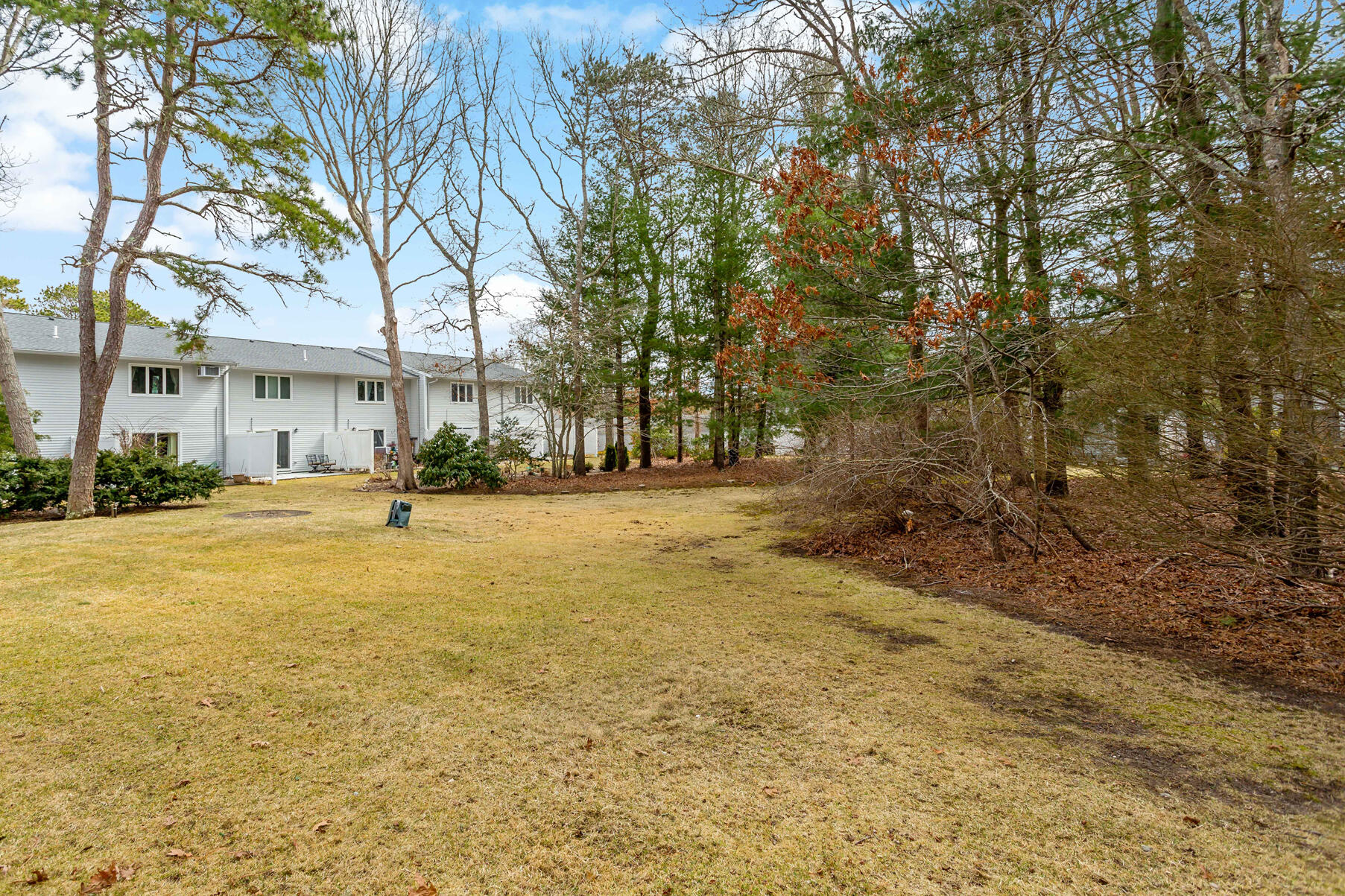 174 Lowell Road, Unit E59 Mashpee, MA 02649 - Photo 16 of 19 backyard