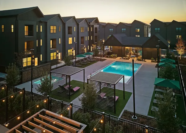a view of a patio with table and chairs and potted plants