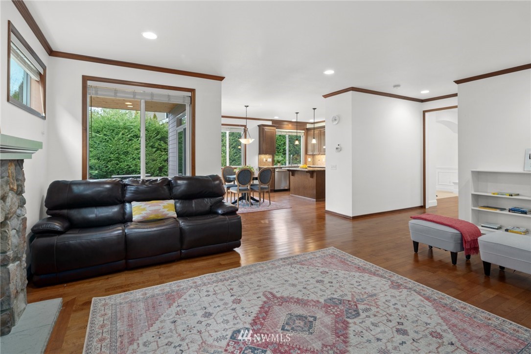 4421 220th Street Southeast Bothell, WA 98021 - Photo 11 of 39 a living room with furniture and a large window