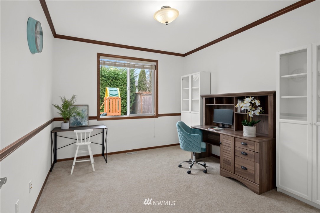 4421 220th Street Southeast Bothell, WA 98021 - Photo 19 of 39 a living room with furniture and a window