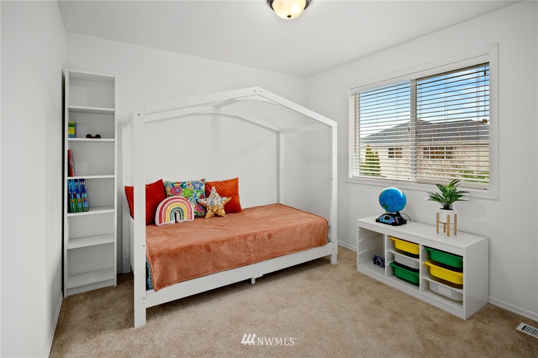 4421 220th Street Southeast Bothell, WA 98021 - Photo 27 of 39 a bedroom with a bed and a window