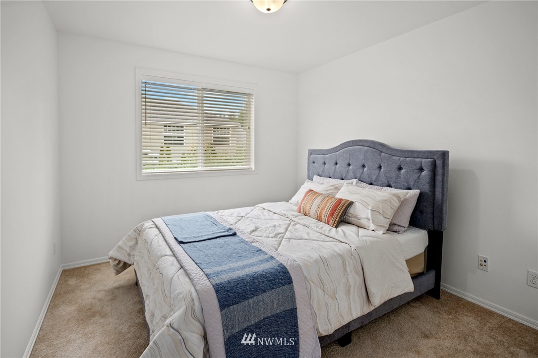 4421 220th Street Southeast Bothell, WA 98021 - Photo 28 of 39 a bedroom with a bed and a window