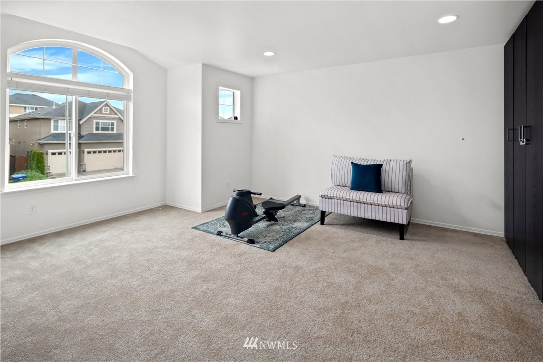 4421 220th Street Southeast Bothell, WA 98021 - Photo 30 of 39 a room with furniture and a window