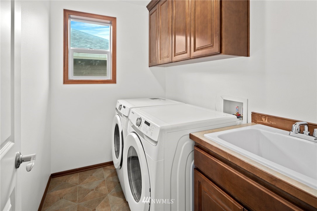 4421 220th Street Southeast Bothell, WA 98021 - Photo 32 of 39 a utility room with dryer and washer