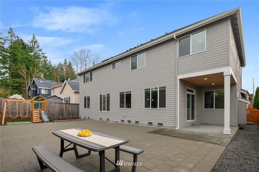 4421 220th Street Southeast Bothell, WA 98021 - Photo 33 of 39 a view of house with backyard and sitting area