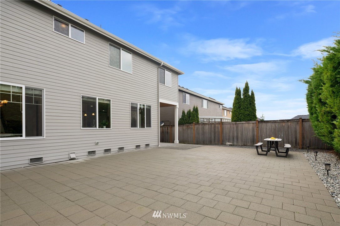 4421 220th Street Southeast Bothell, WA 98021 - Photo 35 of 39 a view of a house with backyard and furniture