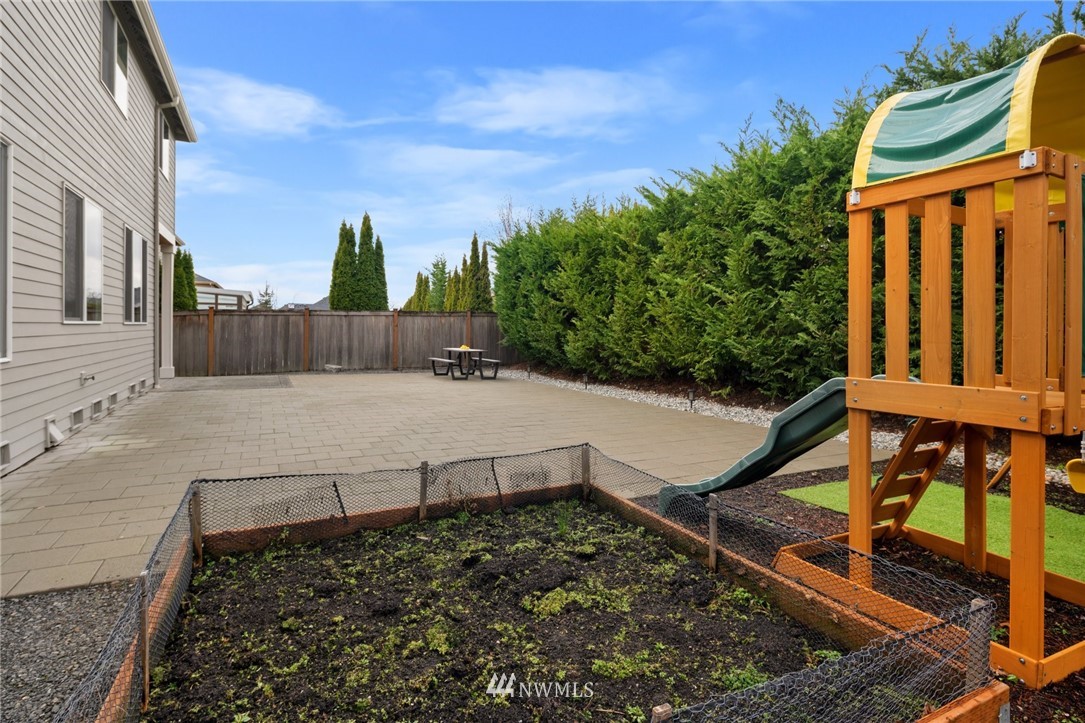 4421 220th Street Southeast Bothell, WA 98021 - Photo 36 of 39 a view of a yard with wooden fence