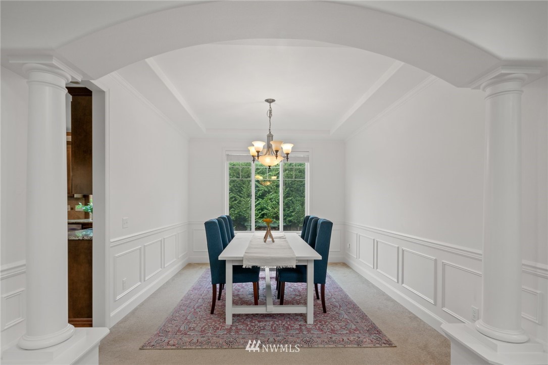 4421 220th Street Southeast Bothell, WA 98021 - Photo 10 of 39 a dining room with furniture window and wooden floor