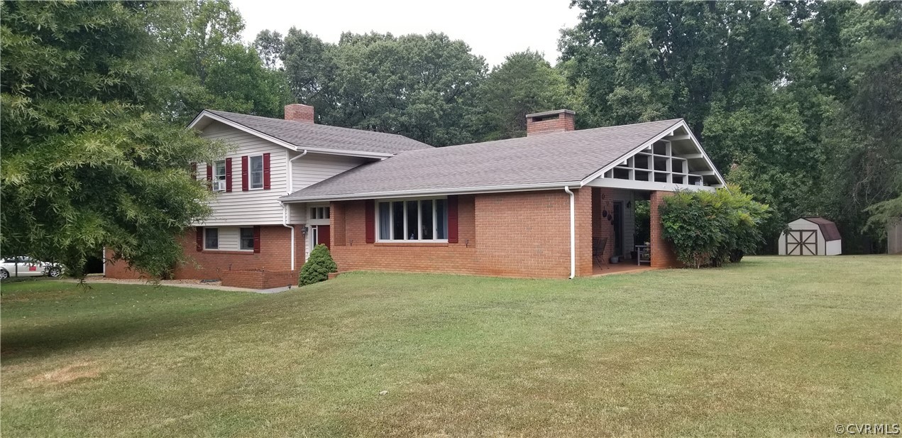 79 High School Road Buckingham, VA 23921 - Photo 22 of 26 front view of a house with a yard