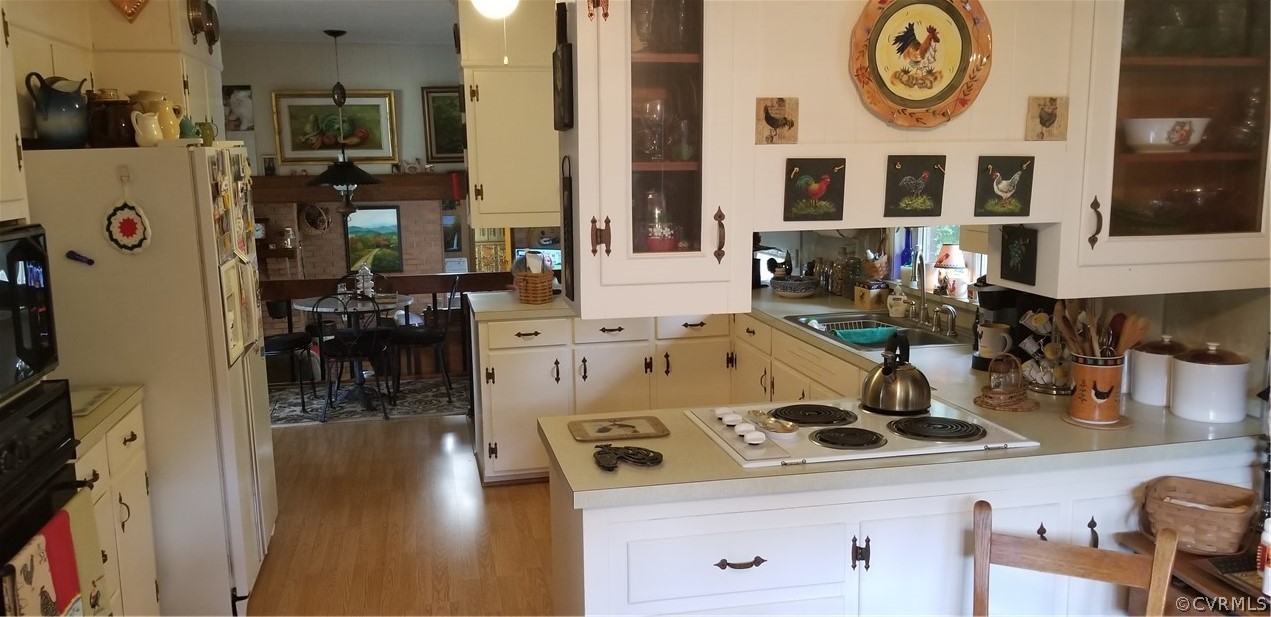 79 High School Road Buckingham, VA 23921 - Photo 6 of 26 a stove top oven sitting inside of a kitchen