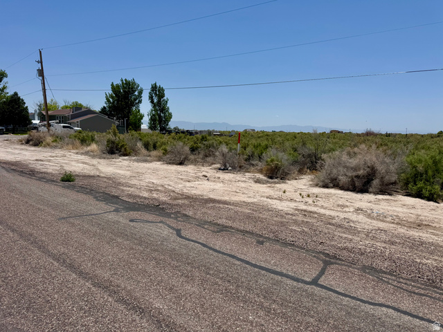 100 East 400th Street South Delta, UT 84624 - Photo 12 of 14 Expansive undeveloped land parcel featuring natural shrubbery and distant mountain formations