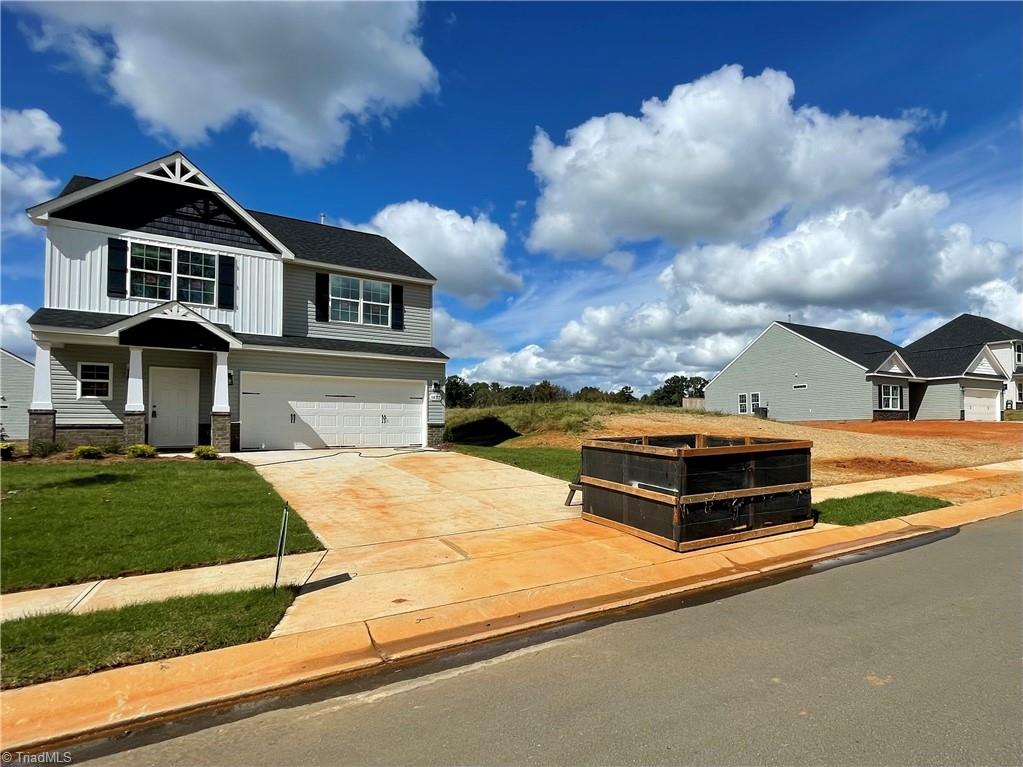 1823 Parham Drive Graham, NC 27253 - Photo 3 of 32 This lot has a Duke Energy Easement on the side that is shared with the other lot as seen in picture. The lot has a front width of 100 ft which allows a lot of distance to the neighboring house.