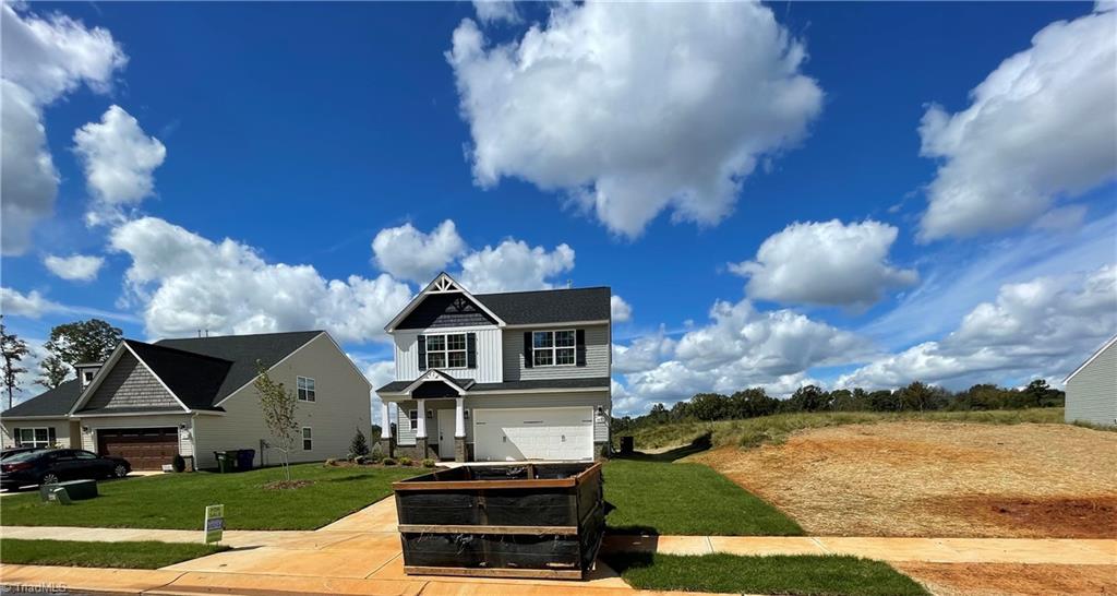 1823 Parham Drive Graham, NC 27253 - Photo 5 of 32 This lot has a Duke Energy Easement on the side that is shared with the other lot as seen in picture. The lot has a front width of 100 ft which allows a lot of distance to the neighboring house.