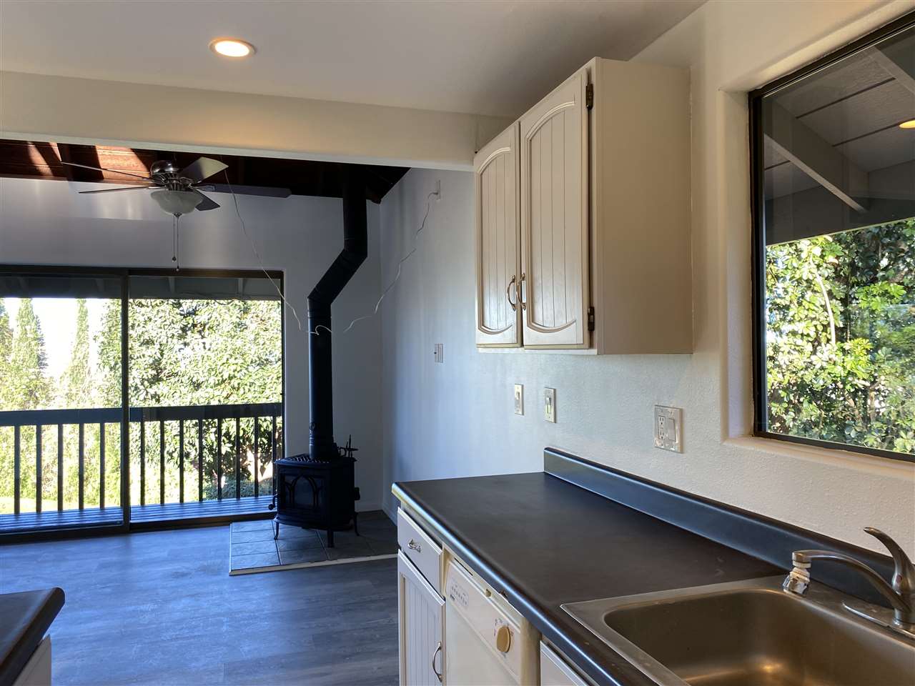 180 Ainakula Road Kula, HI 96790 - Photo 12 of 30 a kitchen with a sink and a large window