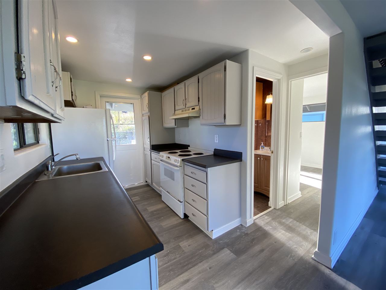 180 Ainakula Road Kula, HI 96790 - Photo 13 of 30 a kitchen with stainless steel appliances a refrigerator stove and sink