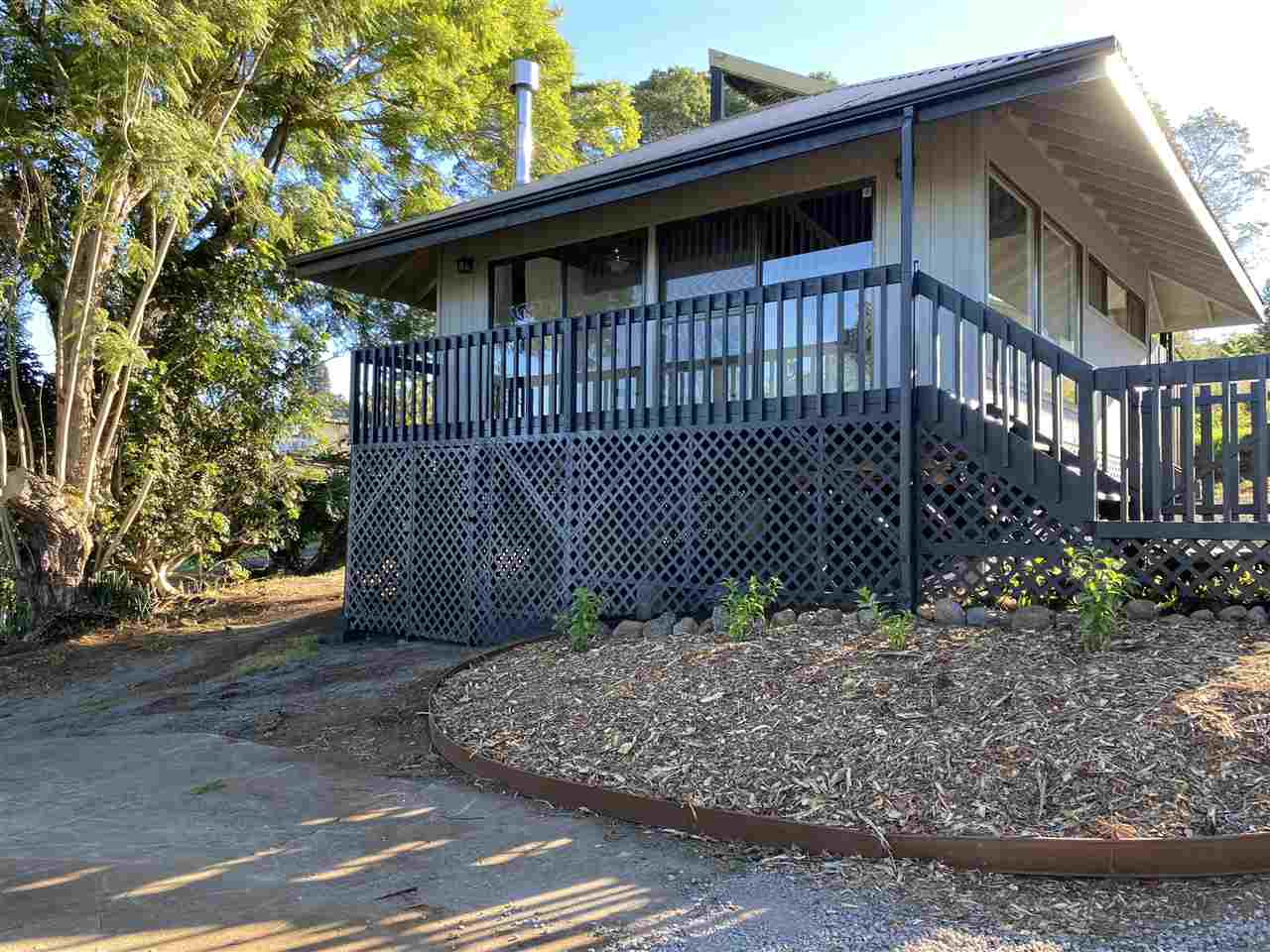 180 Ainakula Road Kula, HI 96790 - Photo 2 of 30 a view of a wooden house with a large window